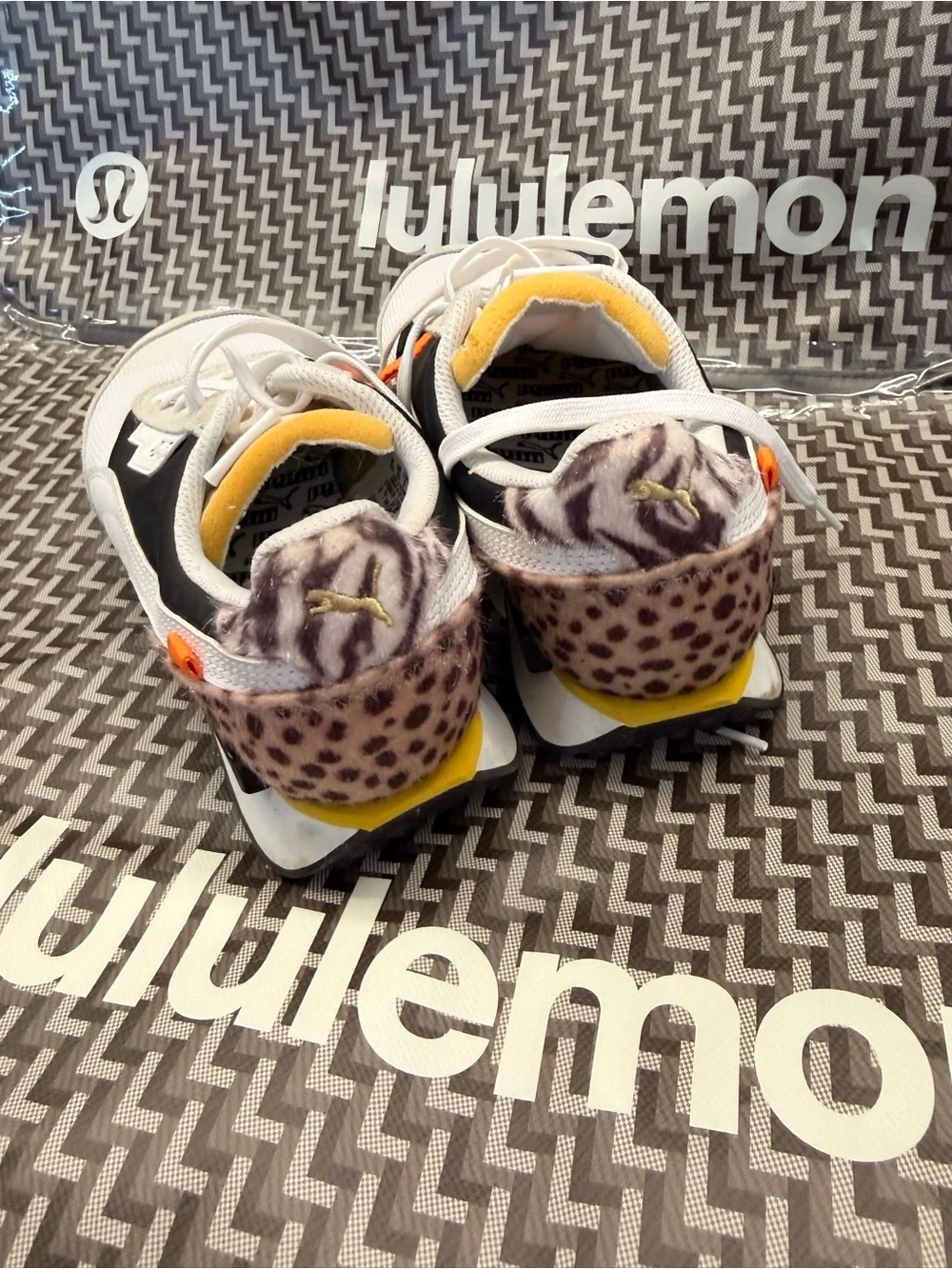 Puma White and Black Retro-Inspired Women's Sneaker with Yellow Accents